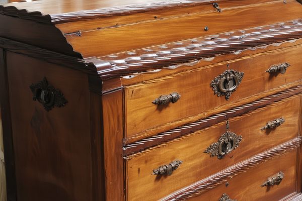 Antique chest restoration showing expert wood refinishing work