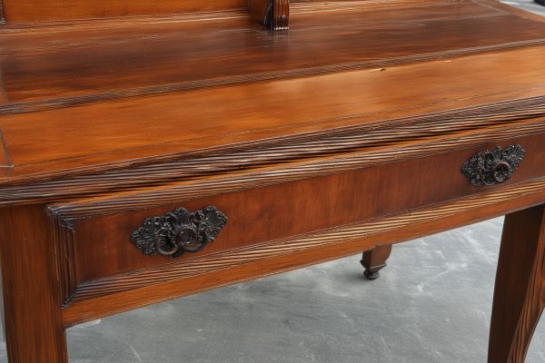 Antique furniture refinishing with careful preservation of original details
